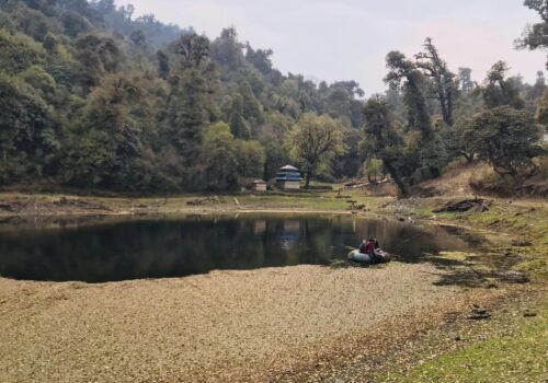 Locals cleaning the weed-covered Paryvarani lake